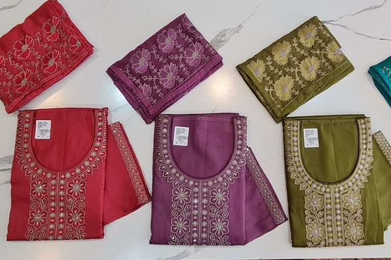 Handcrafted saree draped elegantly, Naari Collection piece.