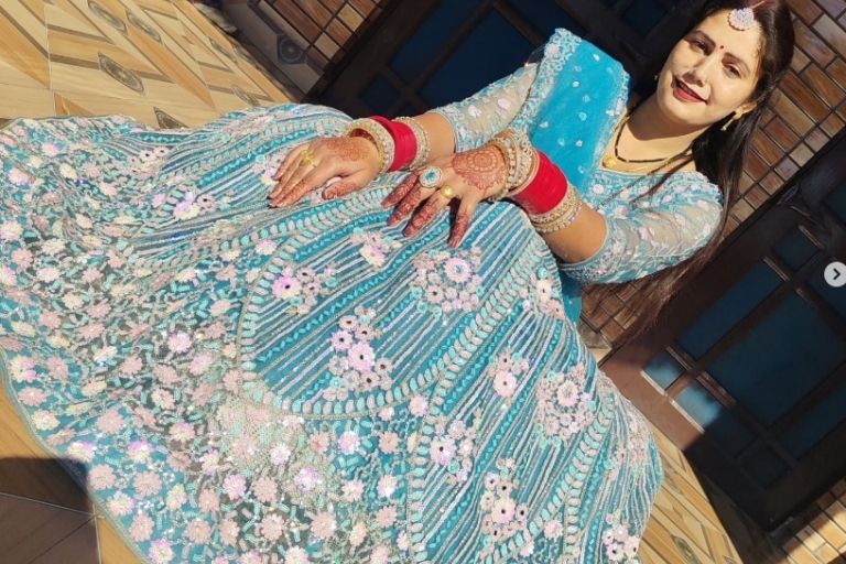 Indian bride wearing traditional wedding lehenga set.