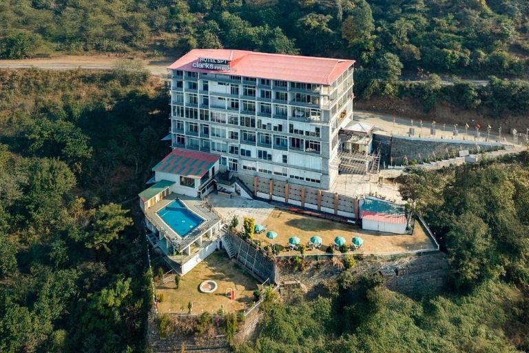 SPT Clarks Inn Suites luxury hotel exterior and entrance