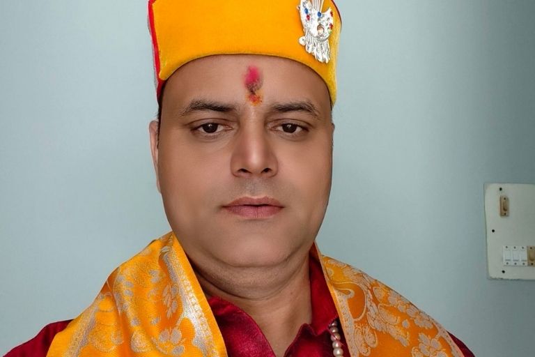 Pujari Bibhu Sharma providing spiritual guidance and blessings